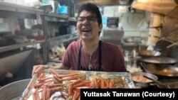 Yuttasak Tanawan, "Chef Tang" prepares King Crab Legs during his live show on social media in Washington,DC. Oct 2020.