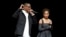 FILE - George Tillman Jr., left, director of the upcoming film "The Hate U Give," and cast member Amandla Stenberg discuss the film during the 20th Century Fox presentation at CinemaCon 2018, the official convention of the National Association of Theatre Owners, at Caesars Palace in Las Vegas, April 26, 2018.
