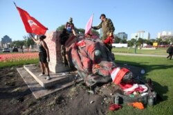 A defaced statue of Queen Victoria lies after being toppled during a rally outside the provincial legislature on Canada Day in Winnipeg, Manitoba, Canada July 1, 2021.