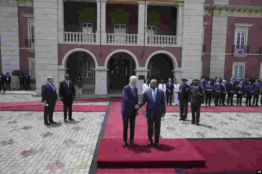 President Joe Biden shakes hand with Angola&#39;s President Joao Lourenco, at the presidential palace in the capital Luanda, Angola, during his first trip to Africa as president.