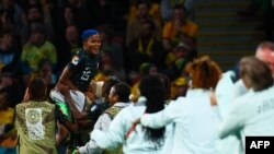 Nigerian striker Rasheedat Ajibade celebrates a goal by her teammate Osinachi Ohale during their second Group B match against Australia at the 2023 FIFA Women's World Cup, July 27, 2023.