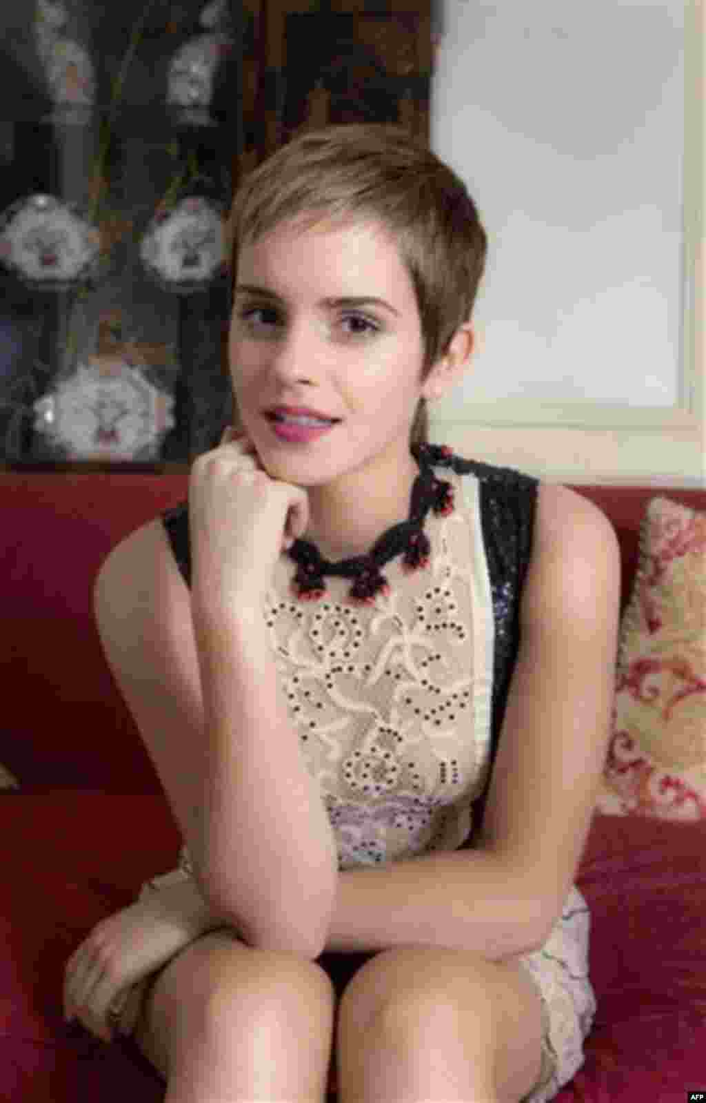 British actress Emma Watson poses for photographs, Friday, Nov. 12, 2010, following an interview with the Associated Press to discuss her role in Harry Potter and the Deathly Hallows Part 1. (AP Photo/Joel Ryan)