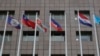 A pole, third from right, where Nauru national flag used to fly is vacant outside the Diplomatic Quarter building in Taipei, Taiwan, Monday, Jan. 15, 2024. The Pacific Island nation of Nauru says it is switching diplomatic recognition from Taiwan to China. 