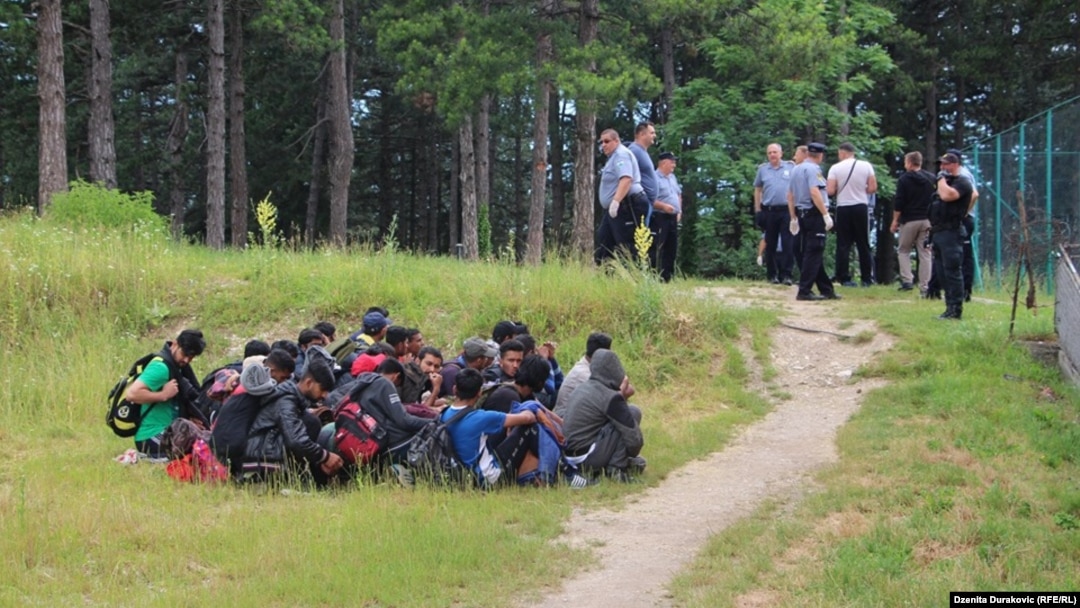 Police escorting migrants from temporary migrant camp Vucjak near Bihac, October 15, 2019.