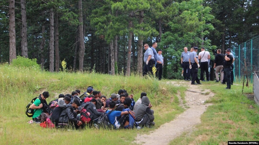 Bosnia and Herzegovina -- Police escorting migrants from temporary migrant camp Vucjak near Bihac, October 15, 2019.
