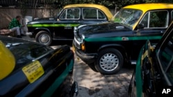 Hindustan Ambassadors taxis are parked outside a hotel in New Delhi, India, Feb. 13, 2017. 