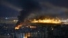 Flames and smoke rise from an Israeli airstrike, as Rafik Hariri international airport is seen in the background, in the southern suburbs of Beirut, Lebanon, Oct. 20, 2024. 