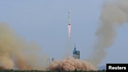 A Long March-2F carrier rocket, carrying the Shenzhou-16 spacecraft and three astronauts, takes off from the launching area of Jiuquan Satellite Launch Center for Tiangong space station, near Jiuquan, Gansu province, China May 30, 2023. China Daily via REUTERS 