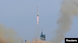 A Long March-2F carrier rocket, carrying the Shenzhou-16 spacecraft and three astronauts, takes off from the launching area of Jiuquan Satellite Launch Center for Tiangong space station, near Jiuquan, Gansu province, China May 30, 2023. China Daily via REUTERS 