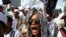 FILE - Members of the militant Islamic Defenders Front (FPI) shout slogan during a demontration in Jakarta, Indonesia.