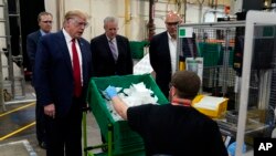 President Donald Trump participates in a tour of a Honeywell International plant that manufactures personal protective equipment, in Phoenix, May 5, 2020.