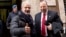 FILE - Reggio Calabria head of Police Guido Longo (L) gives the thumbs up next to FBI special agent Leo Taddeo following a joint Italian-U.S. authorities' press conference on an anti-Mafia blitz with numerous arrests reported on both sides of the Atlantic, Rome.