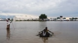 Children play in the floodwaters at the airstrip after the River Nile broke the dykes in Pibor, Greater Pibor Administrative Area, South Sudan, Oct. 6, 2020.