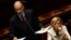 Newly appointed Italian Prime Minister Enrico Letta (L) speaks next to Foreign Minister Emma Bonino at the Lower House of the parliament in Rome, April 29, 2013. 