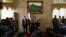 The spokesman of the Shi'ite rebels known as Houthis, Mohammed Abdel Salam, center, speaks at a press conference prior to the departure of the Houthi delegation for the Geneva peace talks, in Sana'a, Yemen, Dec. 12, 2015. 