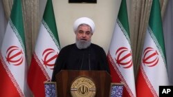 In this photo released by official website of the office of the Iranian Presidency, President Hassan Rouhani addresses the nation in a televised speech in Tehran, Iran, May 8, 2018. 