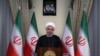 In this photo released by official website of the office of the Iranian Presidency, President Hassan Rouhani addresses the nation in a televised speech in Tehran, Iran, May 8, 2018. 