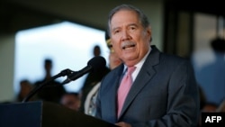 FILE - Colombian Minister of Defense Guillermo Botero speaks during a military ceremony at the Military School of Cadets General Jose Maria Cordova in Bogota, Colombia, Aug. 14, 2018.