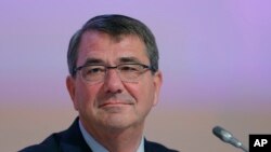 FILE - U.S. Secretary of Defense Ashton Carter delivers a speech during the 14th International Institute for Strategic Studies Shangri-la Dialogue, or IISS, Asia Security Summit, May 30, 2015, in Singapore. 
