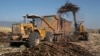 A truck is loaded with sugar cane at a plantation in Cantaranas March 23, 2006.Honduras has become the second Central American nation to make legal and regulatory changes needed to implement a hard-fought free trade agreement with the U.S.. The U.S…