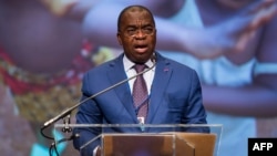 FILE - Cameroon Minister of Economy, Planning and Regional Development Louis Paul Motaze, now the country's finance minister, speaks at the International Monetary Fund's headquarters, in Washington, Oct. 6, 2016.