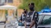Policemen wearing gloves and face masks to help prevent the spread of the coronavirus, provide security for pilgrims, in Mecca, Saudi Arabia, Sunday, July 26, 2020. Only about 1,000 pilgrims will be allowed to perform the annual hajj pilgrimage that…