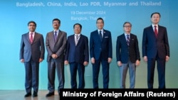 Officials from India, Bangladesh, Myanmar, Thailand, Laos and China pose for a photo before the six-country informal consultation to discuss ways to address shared concerns, in Bangkok, Thailand, Dec. 19, 2024.