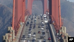 FILE - In this Sept. 19, 2013 file photo, automobile traffic flows over the Golden Gate Bridge in San Francisco. Doctors and California officials will be among those weighing in on the Trump administration's proposal to roll back car-mileage…