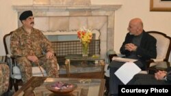 This picture released by Pakistan's army shows General Raheel Sharif meeting with Afghan President Ashraf Ghani, Dec. 27, 2015. 