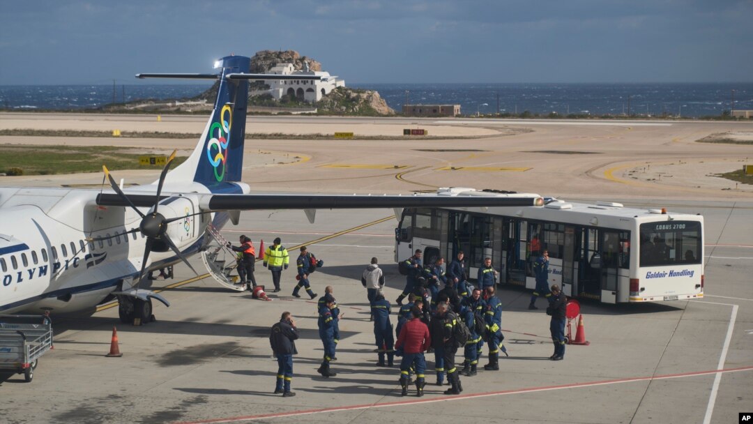 Fire service rescuers arrive at the airport of the earthquake-hit island of Santorini, Greece, Feb. 5, 2025.