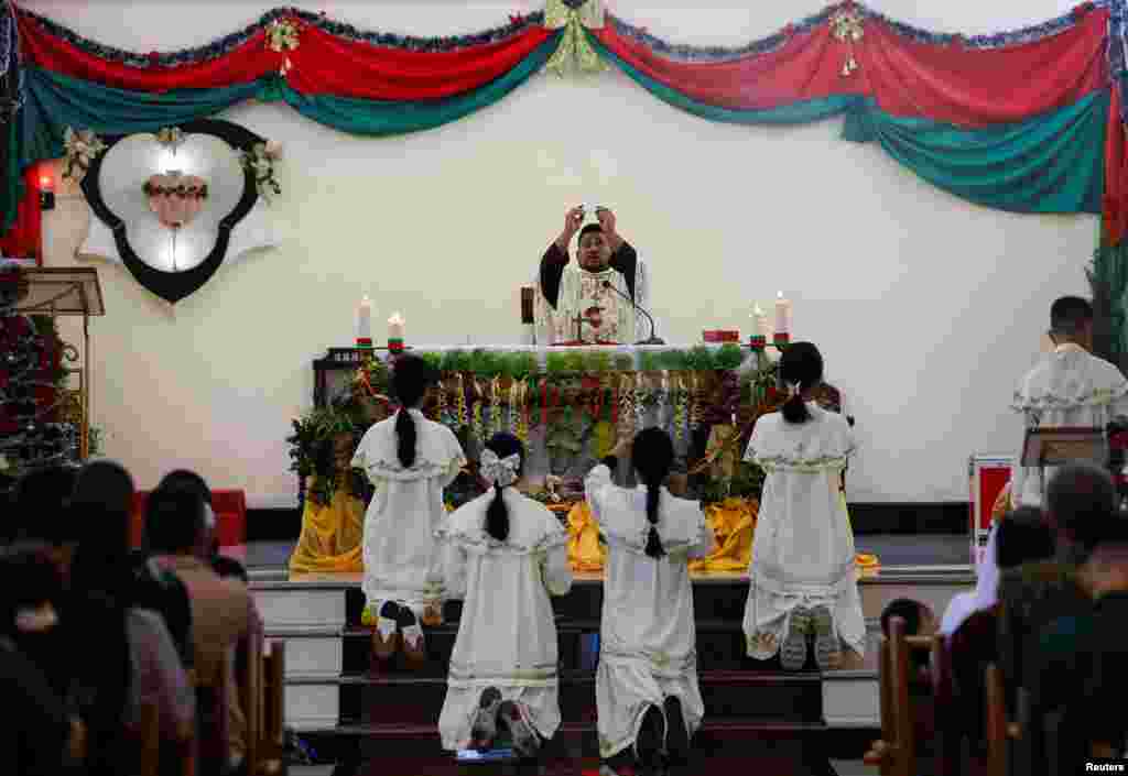 Catholics attend a mass during Christmas celebrations at the Sacred Heart Catholic Church, ahead of the 20th anniversary of Indian Ocean earthquake and tsunami, in Banda Aceh, Aceh, Indonesia, Dec. 25, 2024.