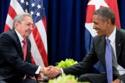 FILE - U.S. President Barack Obama, right, and Cuban President Raul Castro shake hands before a bilateral meeting at the United Nations headquarters in New York, Sept. 29, 2015.