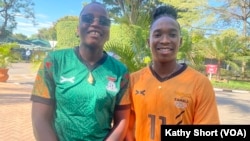 Barbra Banda, captain of the Zambian women's football team, right, and footballer Racheal Kundananji pose for a photo outside the Taj Pamodzi hotel in Lusaka, Zambia, Dec. 20, 2024.