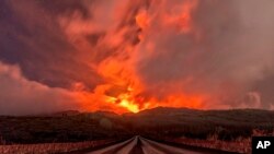 A glowing river of lava flows from the slopes of Mt Etna, Europe&#39;s largest active volcano, near Zafferana Etnea, Sicily, Italy.