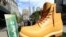 FILE - Timberland drops a 13-foot replica of its iconic wheat boot at a pop-up park in New York City, Oct. 16, 2018.