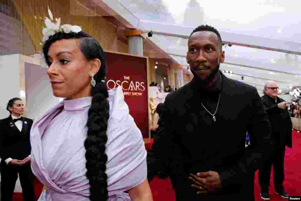 Mahershala Ali and Amatus Sami-Karim walk on the red carpet during the Oscars arrivals at the 92nd Academy Awards in Hollywood, Los Angeles, Feb. 9, 2020. 