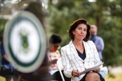 FILE - Rhode Island Gov. Gina Raimondo attends a news conference in Providence, R.I., June 22, 2020.