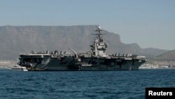 FILE - Aircraft carrier USS Theodore Roosevelt