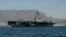 FILE - Aircraft carrier USS Theodore Roosevelt