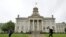 FILE - Students walk past Iowa's Old Capitol on the University of Iowa campus in Iowa City, Oct. 2, 2014. 