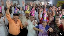 FILE - Elderly Indians participate in celebrations to mark International Day of Older Persons at an old age home in Ahmadabad, India, Oct. 1, 2013.