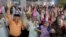 FILE -  Elderly Indians participate in celebrations to mark International Day of Older Persons at an old age home in Ahmadabad, India, Oct. 1, 2013.
