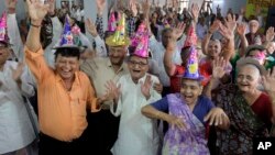 Global Aging: Elderly Indians participate in celebrations to mark International Day of Older Persons at an old age home in Ahmadabad, India.