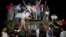 FILE - Civilians with rocks stand on a government armored vehicle near Chang'an Boulevard in Beijing as violence escalated between pro-democracy protesters and Chinese troops, leaving hundreds dead, June 4, 1989.