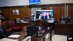 President-elect Donald Trump appears on a video feed for his sentencing for for his hush money conviction in a Manhattan courtroom in New York, Jan. 10, 2025.