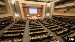 This photograph taken on September 18, 2020, shows a general view on the opening of a meeting of the United Nations Human Rights Council on allegations of torture and other serious violations in Belarus, in Geneva. (Photo by Fabrice COFFRINI/AFP)