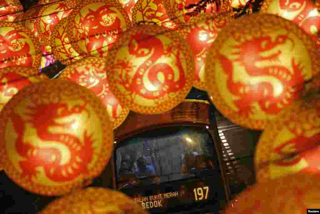 A bus passes street decorations with Chinese zodiac animals ahead of the Lunar New Year in Singapore. The Lunar New Year of the Monkey falls on February 8.