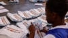 An Electoral Commission of Namibia (ECN) official counts ballots at the Namibia University of Science and Technology polling station in Windhoek on Nov. 28, 2024, following the country's general election. 