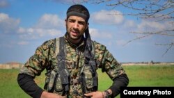 FILE - American volunteer William Savage is pictured during a training session with the Kurdish People’s Protection Units (YPG) in Syria. (Photo courtesy of the YPG Media Center)