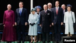 (L-R) The Archbishop of Canterbury Justin Welby, Britain's PM David Cameron, Britain's Queen Elizabeth, Prince Philip, Prince William and Princess Anne attend an event marking the 800th anniversary of Magna Carta in Runymede, June 15, 2015.